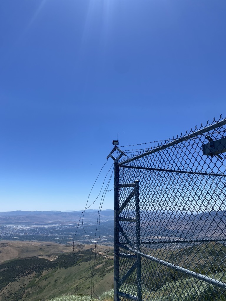 Barbed-wire fence at the High Sierra Communications compound on Peavine Peak, overlooking Reno and Sparks