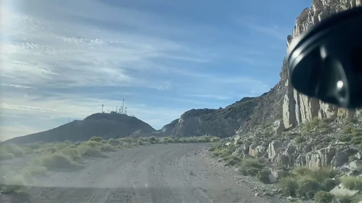 Dirt road toward Brock Mountain with communications towers on the summit