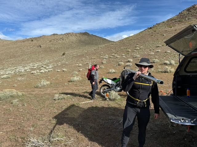 Staging gear at the truck and dirt bike below the Spanish Benchmark ridgeline