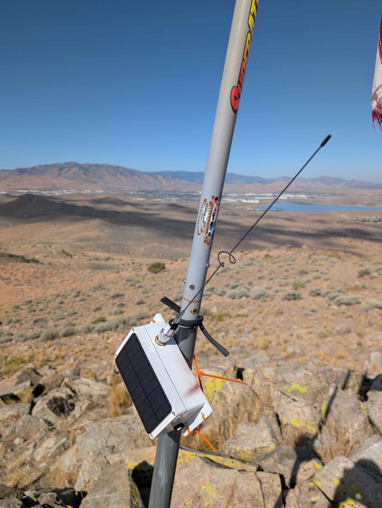 Orange zip-tie mount on the flagpole mast at Spanish Benchmark