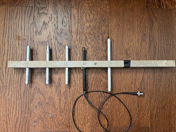 Completed 5-element Yagi prototype on a wooden boom with BNC feed at the driven element